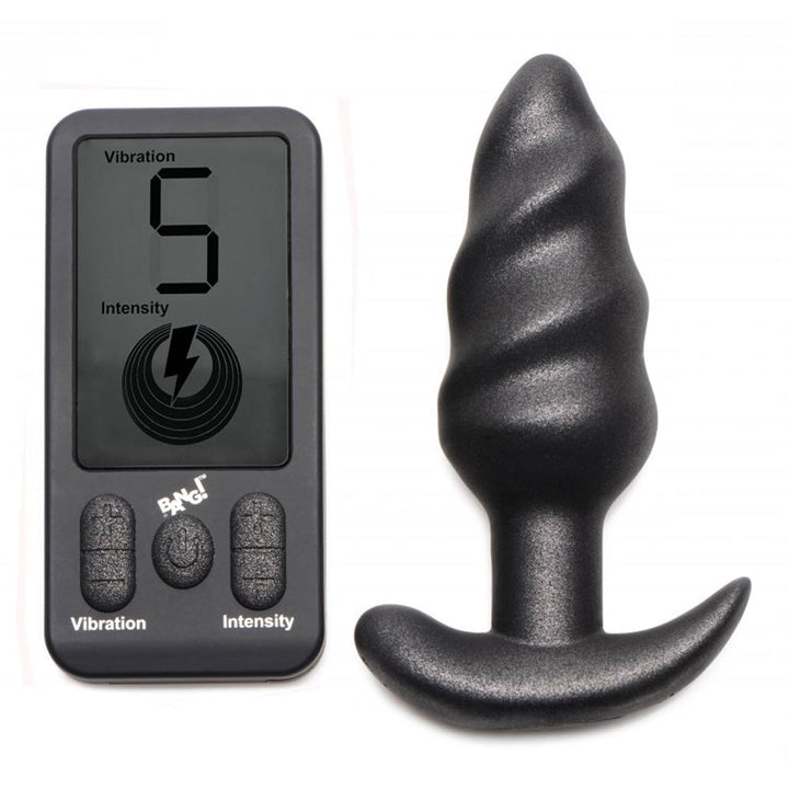 Bang! 25X Swirl Vibrating Butt Plug in black silicone beside LCD remote control