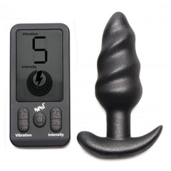 Bang! 25X Swirl Vibrating Butt Plug in black silicone beside LCD remote control