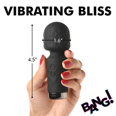 Bang mini wand held in hand with size dimensions: 4.5 inches tall, 1.6-inch head