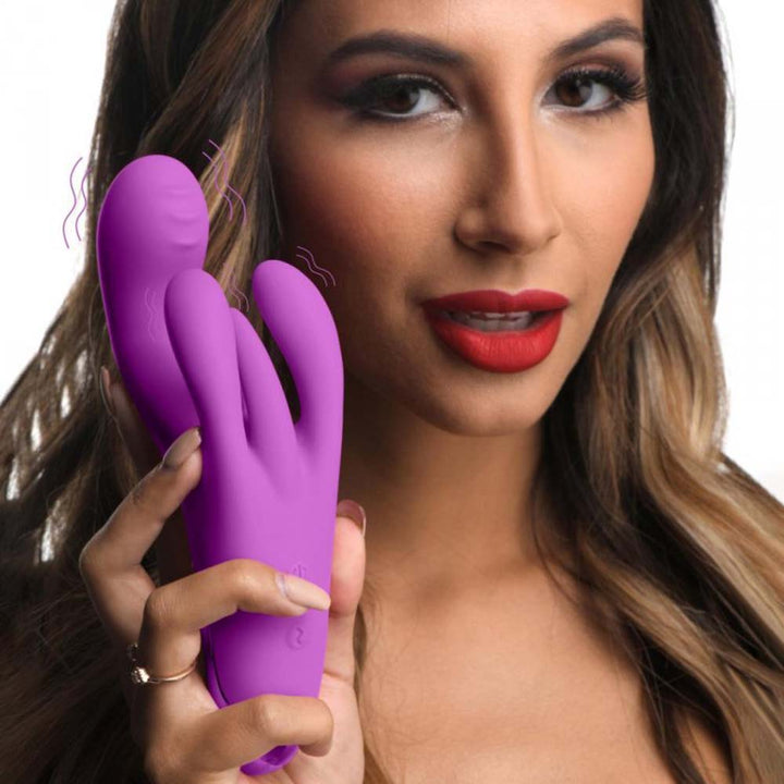 Bang! Triple Rabbit Vibrator in purple silicone held up by a model