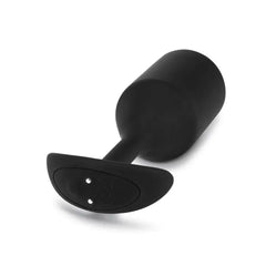 Base of b-Vibe Snug Plug 5 showing magnetic charging contacts on curved anchor base