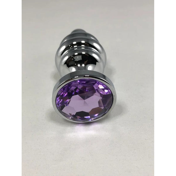 Base view of silver ribbed anal plug showing faceted oval purple crystal set in smooth chrome bezel