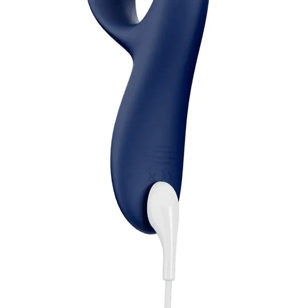 Base of the We-Vibe Nova 2 connected to a white magnetic USB charging cable