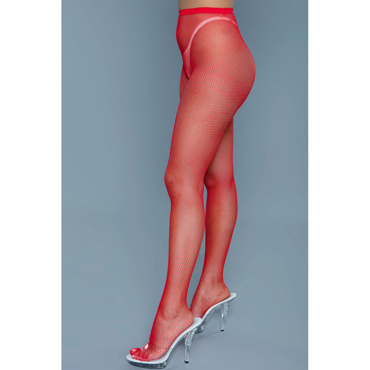 Be Wicked Up All Night Pantyhose in red fishnet, side view showing full leg and clear heel