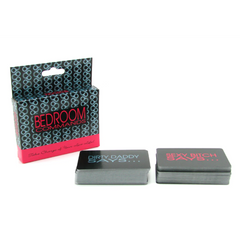 Bedroom Commands card game box beside two separated card decks on white background