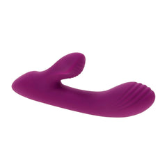 Bitty Bunny rabbit vibrator lying flat, highlighting ridged tip and curved shaft