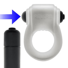 Close-up of black bullet vibrator sliding into the top slot of the REVRING