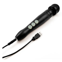 Black Doxy wand massager lying flat with USB charging cable connected at base