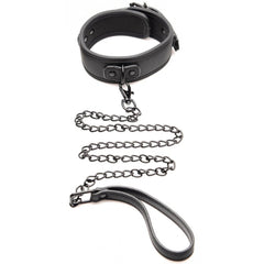 Black faux-leather collar with attached chain leash and loop handle laid on white background