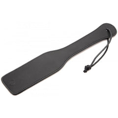 Black faux-leather spanking paddle with stitched edges and knotted wrist cord detail
