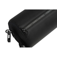 Close-up of black faux-leather spreader bar showing dual zipper closure and wrist clip attachment