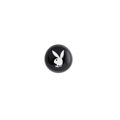 Close-up of black flared base cap featuring the iconic white Playboy Bunny logo