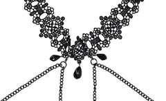 Close-up of black floral lace choker panel with dangling gemstone accents and chain attachments