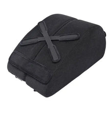 Black foam wedge pillow with X-shaped toy mounting straps, top-down angle