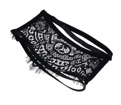 Close-up of black lace blindfold laid flat highlighting sheer floral lace texture and eyelash trim edge