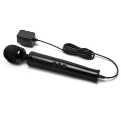 Black Le Wand wand massager shown with attached power cord and wall adapter plug