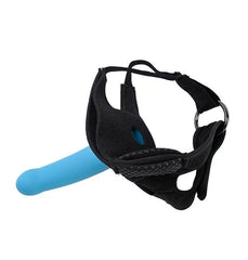 Black neoprene thigh harness with blue dildo inserted, showing adjustable strap and O-ring detail