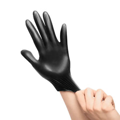 Black nitrile glove being stretched over hand, latex-free and disposable for hygiene