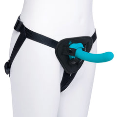 Black nylon strap-on harness worn on mannequin with curved teal silicone dildo inserted