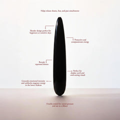Black obsidian slim wand displayed upright with annotated feature callouts highlighting dual-ended design