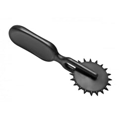 Black plastic Sensation Wheel laid flat, displaying spiked gear wheel and ergonomic handle