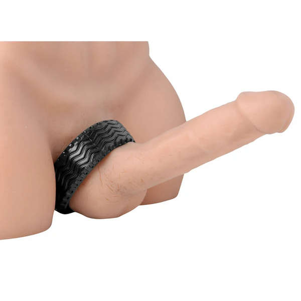 Black ridged cock ring shown fitted at the base on a mannequin torso for scale reference