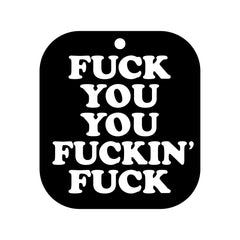 Close-up of black rounded-square air freshener card with bold white typography detail