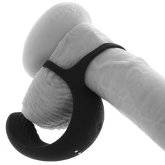 Black silicone ball cradle cock ring shown fitted on a realistic model for scale reference