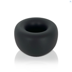 Black silicone ball stretcher shown at a low angle, revealing its wide, rounded body and inner opening