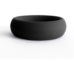 Black silicone cock ring shown at a low angle, highlighting its wide rounded profile