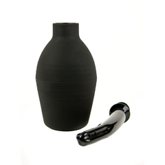 Black silicone douche bulb with ribbed texture beside detached curved nozzle tip