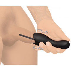 Black silicone penis head teaser shown in use with urethral sound inserted, vibration indicated