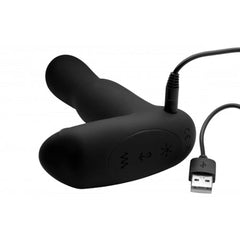 Black silicone prostate vibrator with USB charging cable connected to base control panel