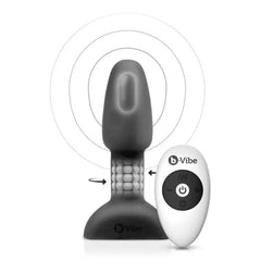 Black silicone rimming plug with rotating bead ring shown alongside wireless remote