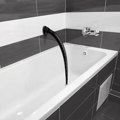 Black silicone tapered hose with suction cup mounted vertically inside a modern white bathtub