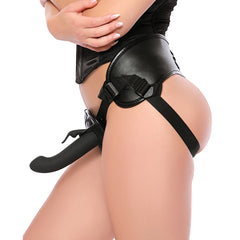 Black vegan leather thigh harness with adjustable nylon straps worn at hip
