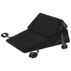 Black velvet wedge and flat bondage cushions stacked together with attached wrist and ankle restraint cuffs