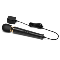Black wand massager with corded power adapter showing plug-in design