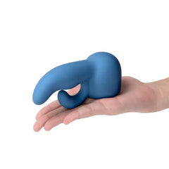Blue Le Wand Dual Petite silicone attachment resting in open palm, showing compact size