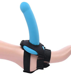 Blue silicone dildo mounted on black adjustable foot harness, side profile view