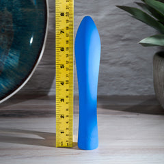 Blue silicone vibrator shown beside ruler measuring approximately 8 inches in length