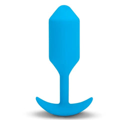 Blue silicone weighted butt plug standing upright, showing tapered tip and anchor base