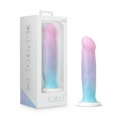 Blush Avant D17 Lucky dildo beside its white retail box, pink-to-blue ombre silicone finish