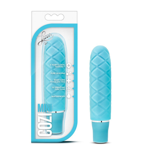 Blush Luxe Cozi Mini vibrator in aqua blue with quilted silicone texture, shown beside its box