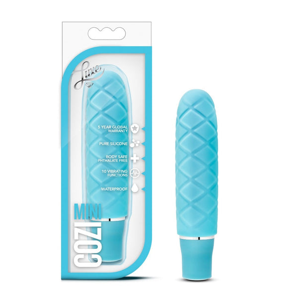 Blush Luxe Cozi Mini vibrator in aqua blue with quilted silicone texture, shown beside its box