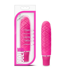 Blush Luxe Cozi Mini vibrator in fuchsia pink with quilted silicone texture, shown beside retail box