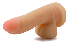 Blush Mighty Mike beige dual-density dildo shown at a side angle highlighting flexible spine