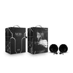 Blush Noir Pom Nipple Clamps displayed beside elegant black Art Deco gift packaging, front and back