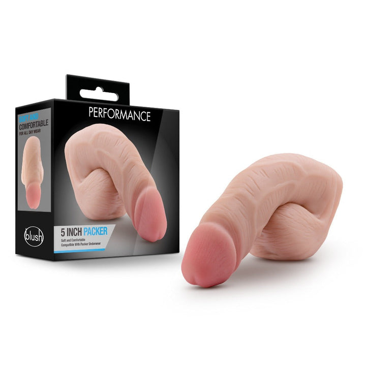 Blush Performance 5 Inch Packer in vanilla beside its retail box, soft skin-tone finish