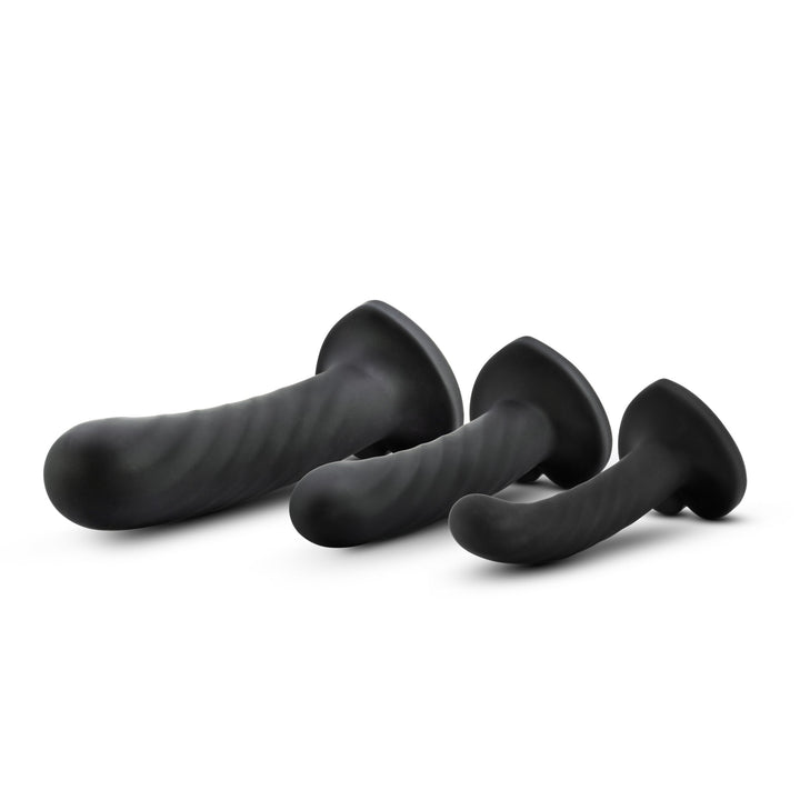 Blush Temptasia Twist Kit three black silicone dildo set with suction cup bases, angled view